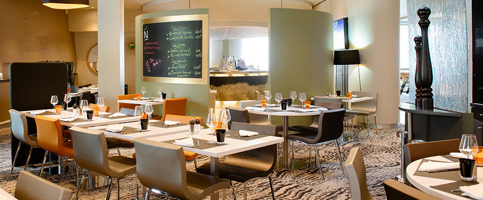 Novotel Lyon Gerland Musée des Confluences ★★★★ - Pastel coloured buildings nestled amongst exotic surroundings. - Lyon, France