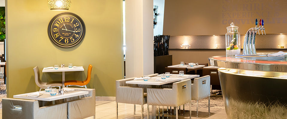 Novotel Lyon Gerland Musée des Confluences ★★★★ - Pastel coloured buildings nestled amongst exotic surroundings. - Lyon, France