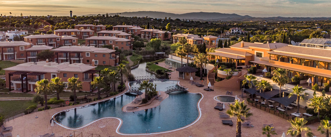 Monte Santo Resort ★★★★★ - Groves of grape trees stand tall against the beautifully wrought limestone rocks in Algarve. - Algarve, Portugal